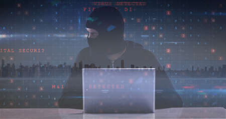 Image of cyber crime text over hacker in balaclava. online security, cyber crime and data processing...