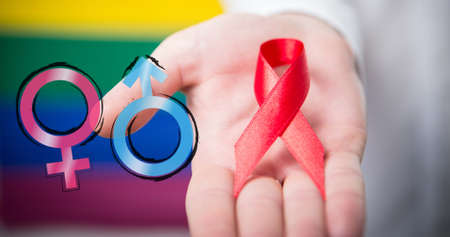 Image of female and male symbols over hand of caucasian man with ribbon. lgbt rights and equality concept digitally generated image.の写真素材