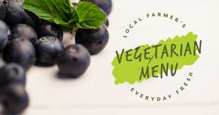 Image of vegetarian menu text in green over fresh organic blueberries. vegan day, organic vegan produce and healthy eating concept digitally generated image.の写真素材