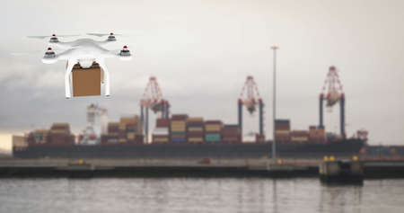 Digital image of a white drone carrying a brown box and hovering in a portの写真素材