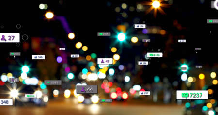 Image of social media icons and numbers over out of focus traffic lights. global social media,...