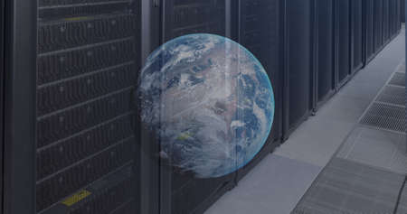Image of globe over server room. cloud computing and data processing concept digitally generated...