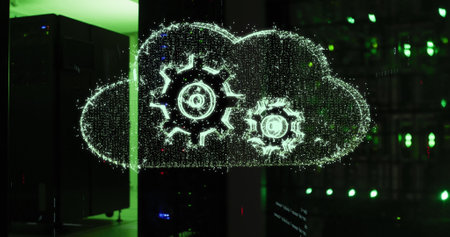 Image of cloud with cogs over server room. global business, finances, connections and digital interface concept digitally generated image.の写真素材