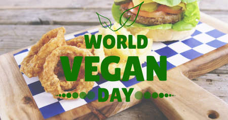 Image of world vegan day text over fresh hamburger. world vegan day and celebration concept...