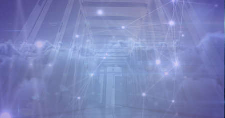 Image of network of connections with clouds over server room. global technology and digital interface concept digitally generated image.の写真素材