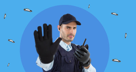 Portrait of young caucasian policeman with walkie-talkie gesturing stop sign on blue background....