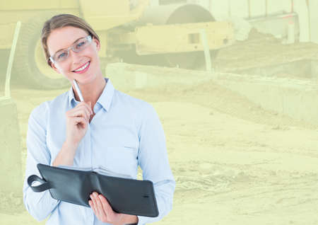 Composite image of caucasian woman with diary smiling against blurred background with copy space....