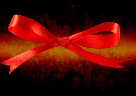 Red ribbon icon against grunge wooden textured background. background with abstract texture and design conceptの写真素材