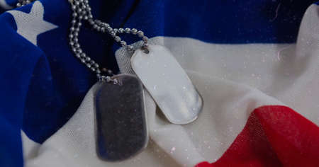 Military dog tags over american flag background with copy space. american independence and patriotism conceptの写真素材