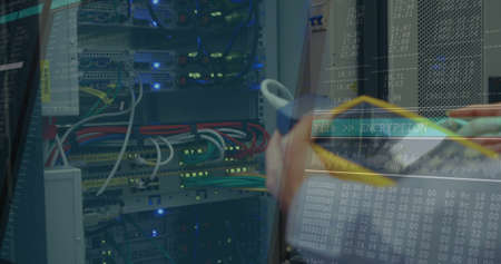 Image of data processing on computer screens over man checking computer server. digital interface,...