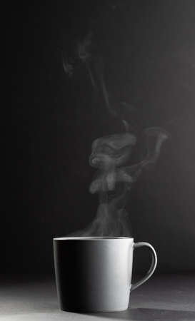 Image of grey cup of hot black coffee on black background. Coffee, refreshment and beverages.の写真素材