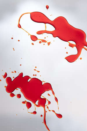 Composition of multiple red blood stains on white background. Halloween, autumn, tradition and celebration concept.の写真素材