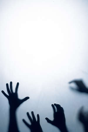 Composition of shape of multiple black hands on white background. Halloween tradition and celebration concept.の写真素材