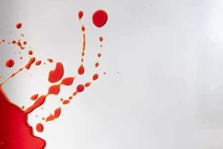 Composition of multiple red blood stains on white background. Halloween, autumn, tradition and celebration concept.の写真素材