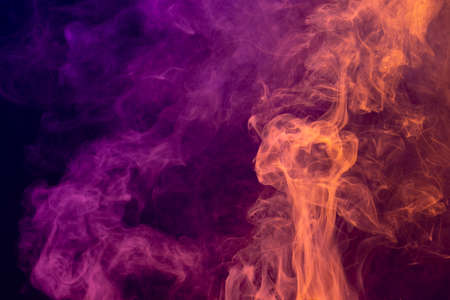 Composition of white smoke with red light on black background. Halloween tradition and celebration concept.の写真素材