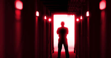Image of man silhouette standing in dark corridor. Horror, fright, halloween and computer games concept digitally generated image.の写真素材