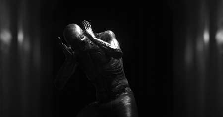 Image of human like monster in dark tunnel being stunned. Horror, fright, image games and science fiction concept digitally generated image.の写真素材