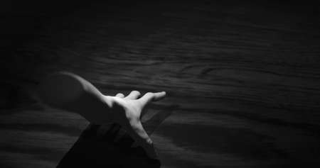 Image of hand walking in dark space. Horror, fright and halloween concept digitally generated image.の写真素材