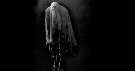 Image of moving ghost and smoke on black background. Halloween and ghosts concept digitally...