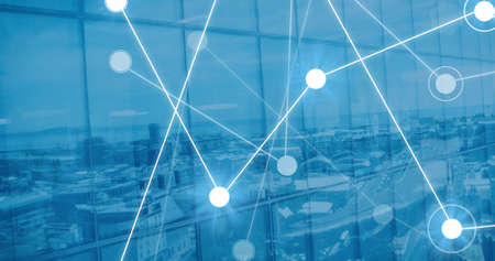 Image of network of connections with glowing spots over cityscape. Global technology, computing and...