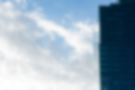 Low angle view of modern building against sky in cityの写真素材