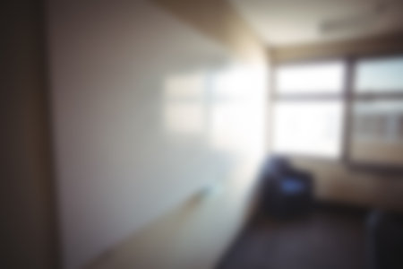Defocused image of wall by window in room