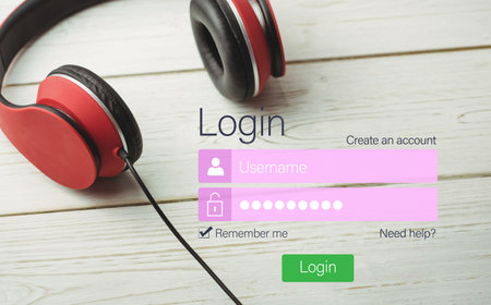 Log on screen by headphones on table of digital device