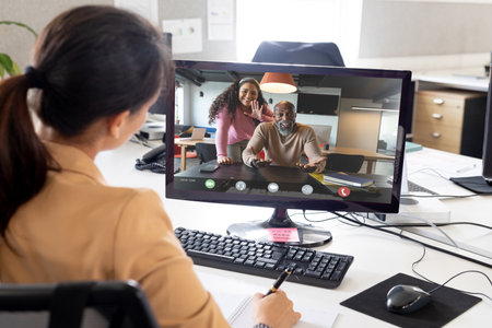 Composition of caucasian businesswoman having video call with colleagues. Global business and data...