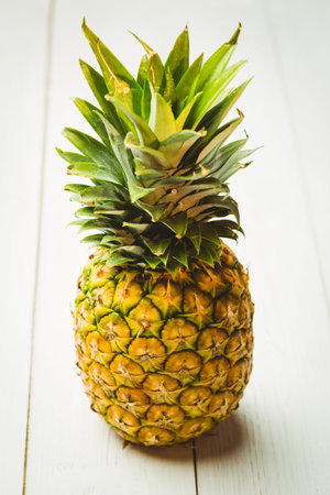 Fresh pineapple on wooden table