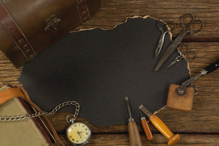 Paper piece with tools on table, Close-up
