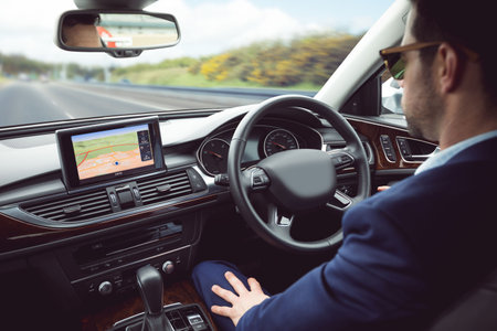 man behind the wheel wearing sunglassesの写真素材