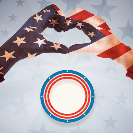Digitally generated image of human hands with heart shape gesture against american flagの写真素材
