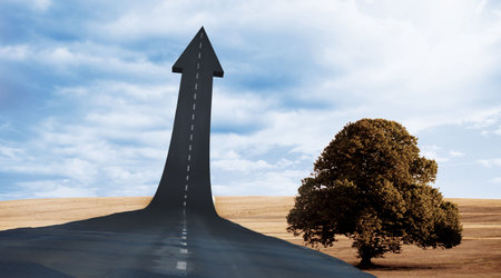 Upward arrow road against cloudy sky