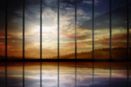 Scenic view of cloudy sky seen through silhouette metal grate during sunset