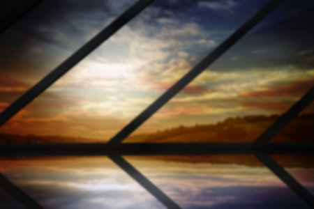 Scenic view of cloudy sky seen through metal grate during sunsetの写真素材