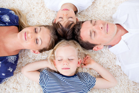 Relaxed family lying in circleの写真素材