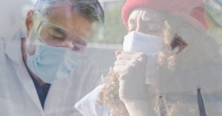Digital illustration of a doctor wearing a face mask and protective goggles over a woman wearing a...