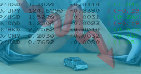 Digital illustration of person sitting with toy car by him over red economy arrow going down, statistics showing. Finance business stock market global data processing concept digitally generated imageの写真素材