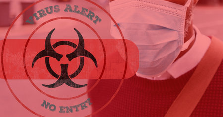 Digital illustration of a hazard sign with a bandage and Virus alert, No entry signs over a man wearing a face mask, walking on a street in the background. Medicine public health pandemic coronavirus Covid 19 outbreak concept digital composite.の写真素材