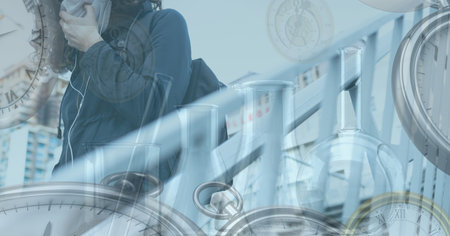 Digital illustration of a woman wearing a face mask, walking down the stairs over test tubes in the background. Medicine public health pandemic coronavirus Covid 19 outbreak concept digital composite.の写真素材