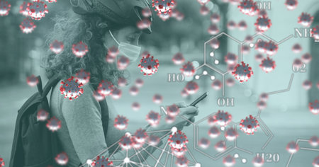 Digital illustration of macro Covid-19 cells and chemical elements floating over a woman wearing a...