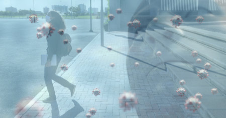 Digital illustration of macro Covid-19 cells floating over a woman wearing a face mask, walking on a...