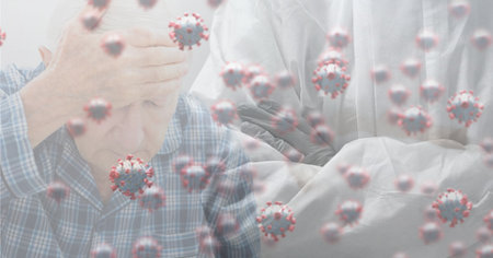 Digital illustration of macro Covid-19 cells floating over senior Caucasian man holding his head. Coronavirus Covid-19 pandemic concept digital compositeの写真素材