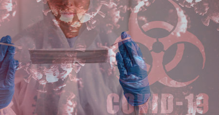 Digital illustration of a red hazard sign with a word Covid-19, macro Covid-19 cells floating over a doctor holding a face mask. Coronavirus Covid-19 pandemic concept digitally generatedの写真素材
