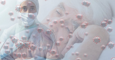 Digital illustration of macro Covid-19 cells floating with Caucasian female doctor wearing protective clothes over senior Caucasian man. Coronavirus Covid-19 pandemic concept digital compositeの写真素材