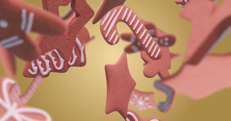 Image of gingerbread falling at christmas over orange background. Christmas, tradition and digital interface concept digitally generated image.の写真素材
