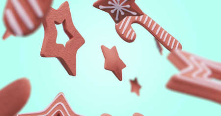 Image of gingerbread falling at christmas over white background. Christmas, tradition and digital interface concept digitally generated image.の写真素材