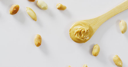 Image of close up of peanut butter on white background. Food, party and copy space concept.の写真素材