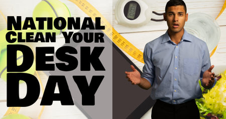 Composite of national clean your desk day text and surprised biracial man gesturing against desk....