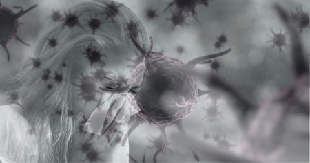 Black and white image of virus cells over caucasian woman blowing nose with a tissue. Medical...
